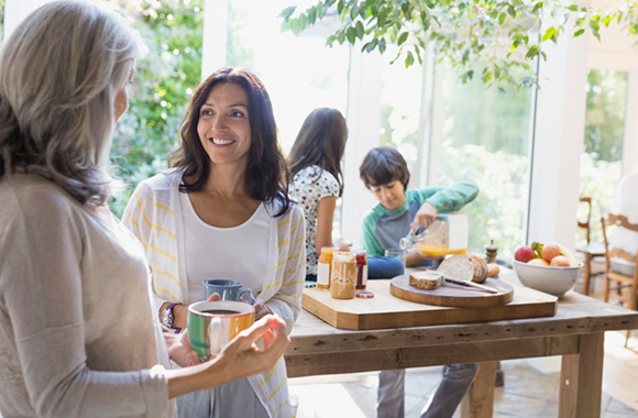 Multi-generation family talking in kitchen